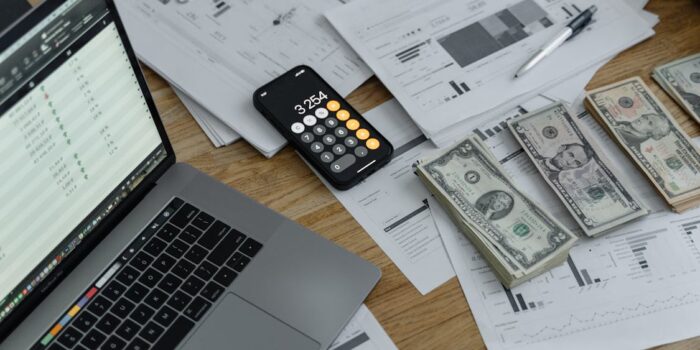 Person holding credit card making a decision