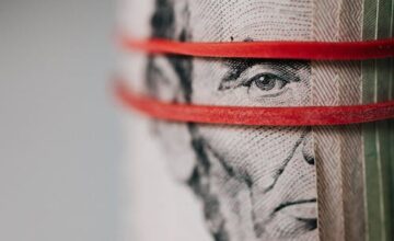 Person reviewing loan documents at desk